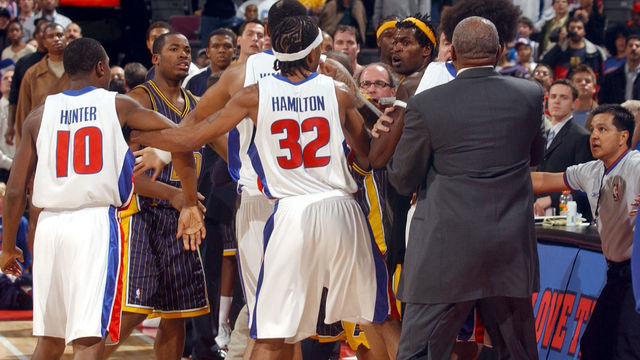 AUBURN HILLS, MI - NOVEMBER 19: Jermaine O'Neal #7 (yellow headband) and other members of the Indiana Pacers scuffle with members of the Detroit Pistons during a melee involving fans at a game against the Detroit Pistons November 19, 2004 at the Palace of Auburn Hills, in Auburn Hills, Michigan. NOTE TO USER: User expressly acknowledges and agrees that, by downloading and/or using this Photograph, user is consenting to the terms and conditions of the Getty Images License Agreement. Mandatory Copyright Notice: Copyright 2004 NBAE