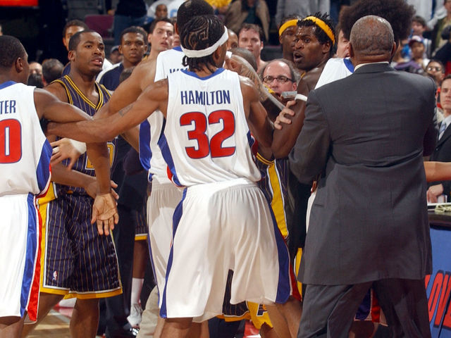 AUBURN HILLS, MI - NOVEMBER 19: Jermaine O'Neal #7 (yellow headband) and other members of the Indiana Pacers scuffle with members of the Detroit Pistons during a melee involving fans at a game against the Detroit Pistons November 19, 2004 at the Palace of Auburn Hills, in Auburn Hills, Michigan. NOTE TO USER: User expressly acknowledges and agrees that, by downloading and/or using this Photograph, user is consenting to the terms and conditions of the Getty Images License Agreement. Mandatory Copyright Notice: Copyright 2004 NBAE