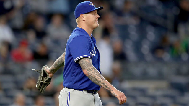 NEW YORK, NY - MAY 02: Mat Latos #57 of the Toronto Blue Jays reacts after giving up back to back home runs in the second inning against the New York Yankees on May 2, 2017 at Yankee Stadium in the Bronx borough of New York City.