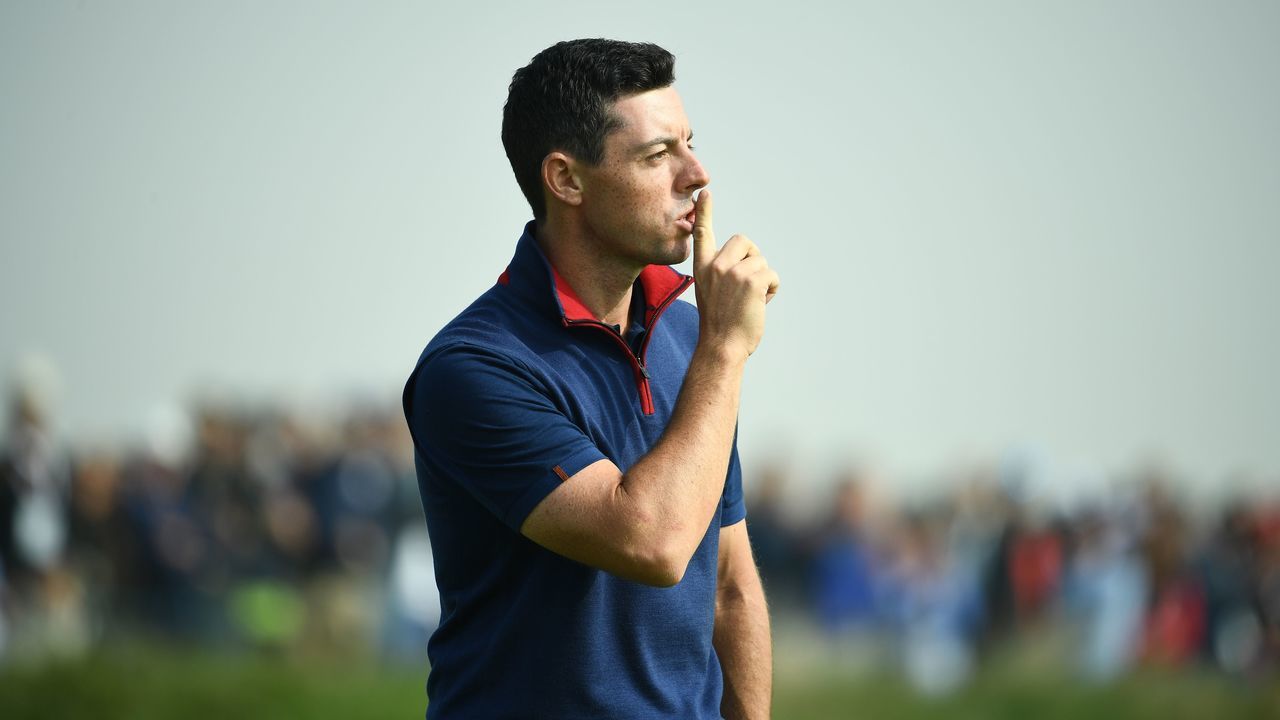 Europe's Northern Irish golfer Rory McIlroy reacts during his foursomes match on the first day of the 42nd Ryder Cup at Le Golf National Course at Saint-Quentin-en-Yvelines, south-west of Paris on September 28, 2018.