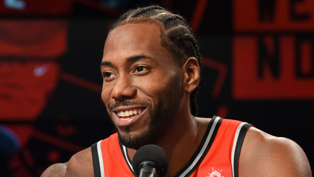 TORONTO, ON - SEPTEMBER 24: Kawhi Leonard #2 of the Toronto Raptors smiles at a press conference after media day on September 24, 2018 at the Air Canada Centre in Toronto, Ontario, Canada. Mandatory Copyright Notice: Copyright 2018 NBAE