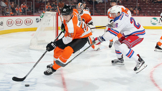 PHILADELPHIA, PENNSYLVANIA - SEPTEMBER 27: James van Riemsdyk #25 of the Philadelphia Flyers moves the puck away from Jimmy Vesey #26 of the New York Rangers during the first period at the Wells Fargo Center on September 27, 2018 in Philadelphia, Pennsylvania.