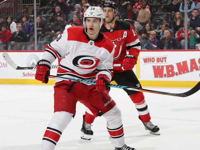NEWARK, NJ - MARCH 27: Sebastian Aho #20 of the Carolina Hurricanes skates against the New Jersey Devils at the Prudential Center on March 27, 2018 in Newark, New Jersey.