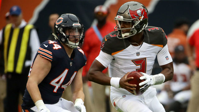 CHICAGO, IL - SEPTEMBER 30: Quarterback Jameis Winston #3 of the Tampa Bay Buccaneers controls the football past Nick Kwiatkoski #44 of the Chicago Bears in the third quarter at Soldier Field on September 30, 2018 in Chicago, Illinois.