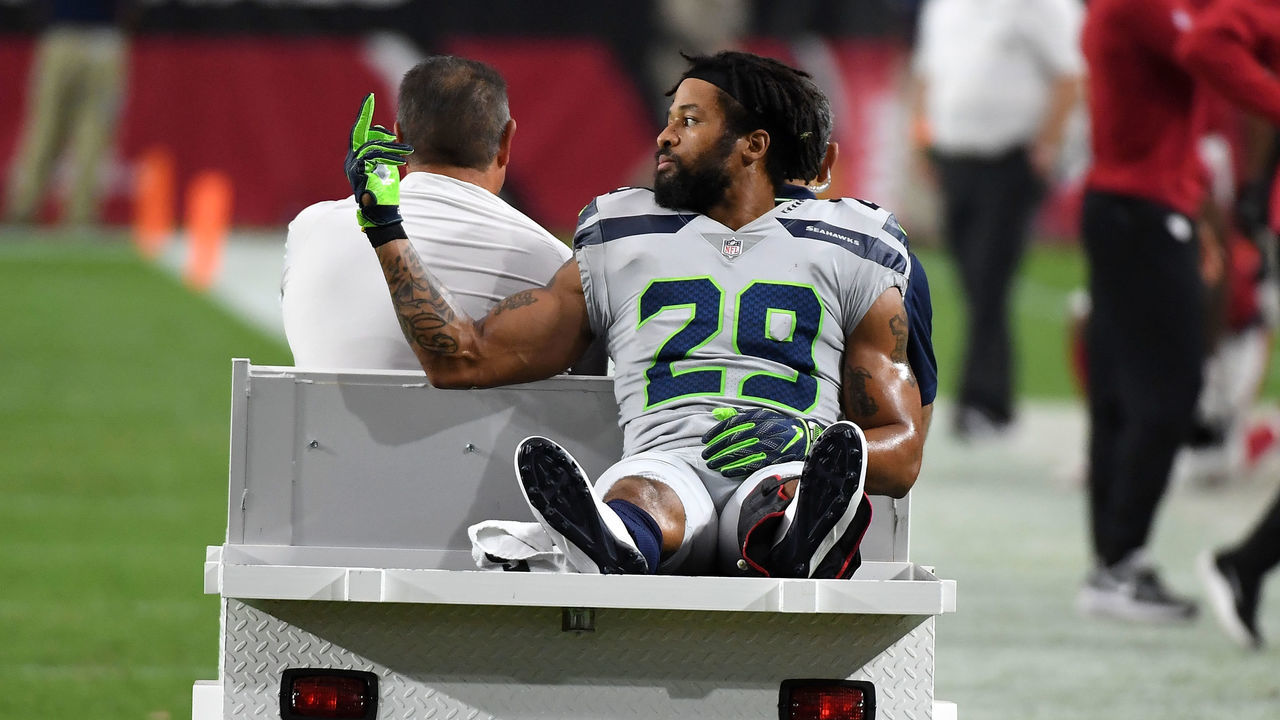 GLENDALE, AZ - SEPTEMBER 30: Defensive back Earl Thomas #29 of the Seattle Seahawks gestures as he leaves the field on a cart after being injured during the fourth quarter against the Arizona Cardinals at State Farm Stadium on September 30, 2018 in Glendale, Arizona.