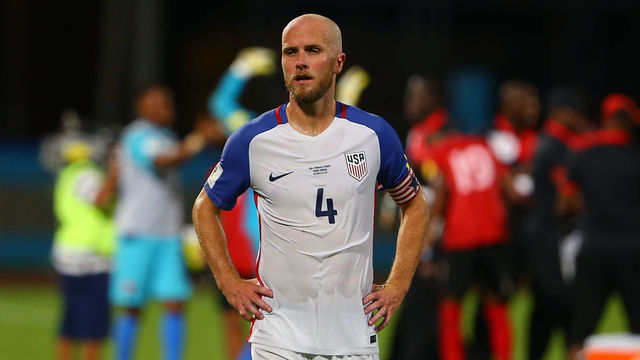COUVA, TRINIDAD AND TOBAGO - OCTOBER 10: A contrast of emotions as captain Michael Bradley (C) of the United States mens national team reacts as Trinidad and Tobago pull of a win during the FIFA World Cup Qualifier match between Trinidad and Tobago at the Ato Boldon Stadium on October 10, 2017 in Couva, Trinidad And Tobago.