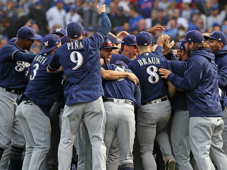 Milwaukee Brewers' Lorenzo Cain and Orlando Arcia smile during the