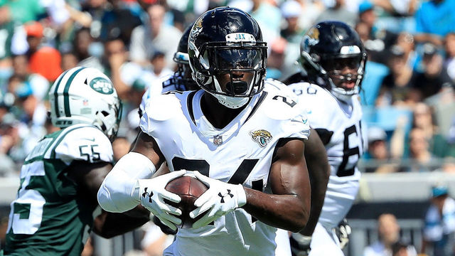 JACKSONVILLE, FL - SEPTEMBER 30: T.J. Yeldon #24 of the Jacksonville Jaguars runs for yardage during the game against the New York Jets on September 30, 2018 in Jacksonville, Florida.