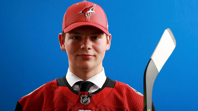 DALLAS, TX - JUNE 22: Barrett Hayton poses after being selected fifth overall by the Arizona Coyotes during the first round of the 2018 NHL Draft at American Airlines Center on June 22, 2018 in Dallas, Texas.