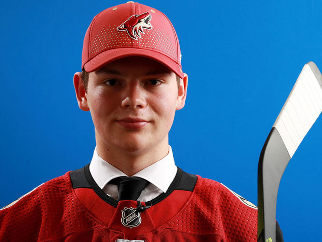 DALLAS, TX - JUNE 22: Barrett Hayton poses after being selected fifth overall by the Arizona Coyotes during the first round of the 2018 NHL Draft at American Airlines Center on June 22, 2018 in Dallas, Texas.