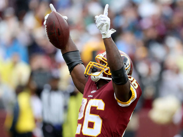 LANDOVER, MD - SEPTEMBER 23: Adrian Peterson #26 of the Washington Redskins celebrates after rushing for a first half touchdown against the Green Bay Packers at FedExField on September 23, 2018 in Landover, Maryland.