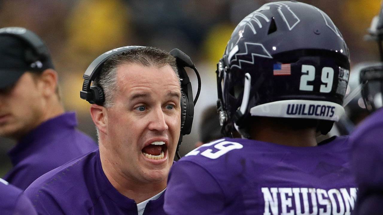 EVANSTON, IL - SEPTEMBER 29: Head coach Pat Fitzgerald of the Northwestern Wildcats gives instructions to Greg Newsome II #29 against the Michigan Wolverines at Ryan Field on September 29, 2018 in Evanston, Illinois.