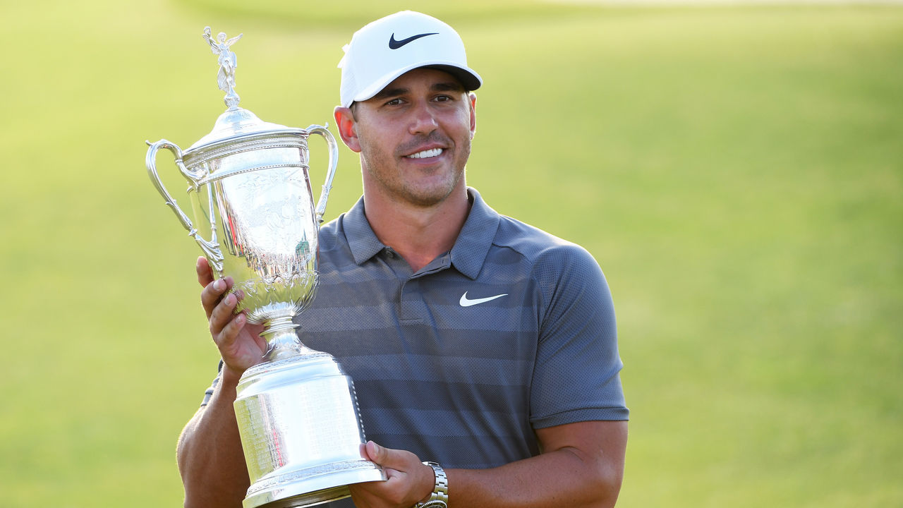 SOUTHAMPTON, NY - JUNE 17: Brooks Koepka of the United States celebrates with the U.S. Open Championship trophy after winning the 2018 U.S. Open at Shinnecock Hills Golf Club on June 17, 2018 in Southampton, New York.