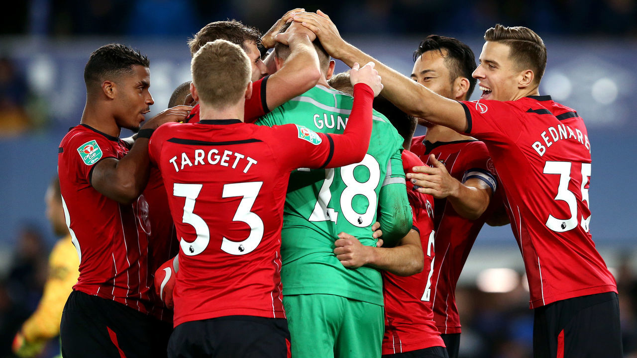 LIVERPOOL, ENGLAND - OCTOBER 02: Angus Gunn of Southampton celebrates with his teammates, as Southampton win the penalty shoot out during the Carabao Cup Third Round match between Everton and Southampton at Goodison Park on October 2, 2018 in Liverpool, England.