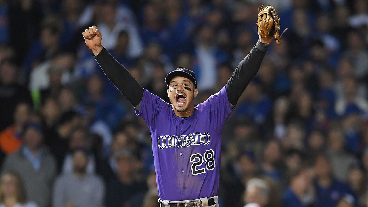 CHICAGO, IL - OCTOBER 02: Nolan Arenado #28 of the Colorado Rockies celebrates defeating the Chicago Cubs 2-1 in thirteen innings to win the National League Wild Card Game at Wrigley Field on October 2, 2018 in Chicago, Illinois.