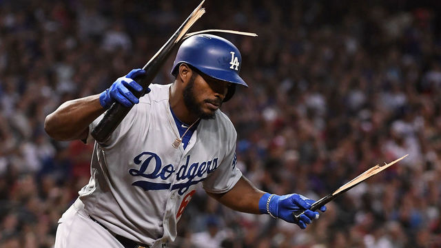 PHOENIX, AZ - SEPTEMBER 26: Yasiel Puig #66 of the Los Angeles Dodgers breaks his bat after popping out in the fifth inning of the MLB game against the Arizona Diamondbacks at Chase Field on September 26, 2018 in Phoenix, Arizona.