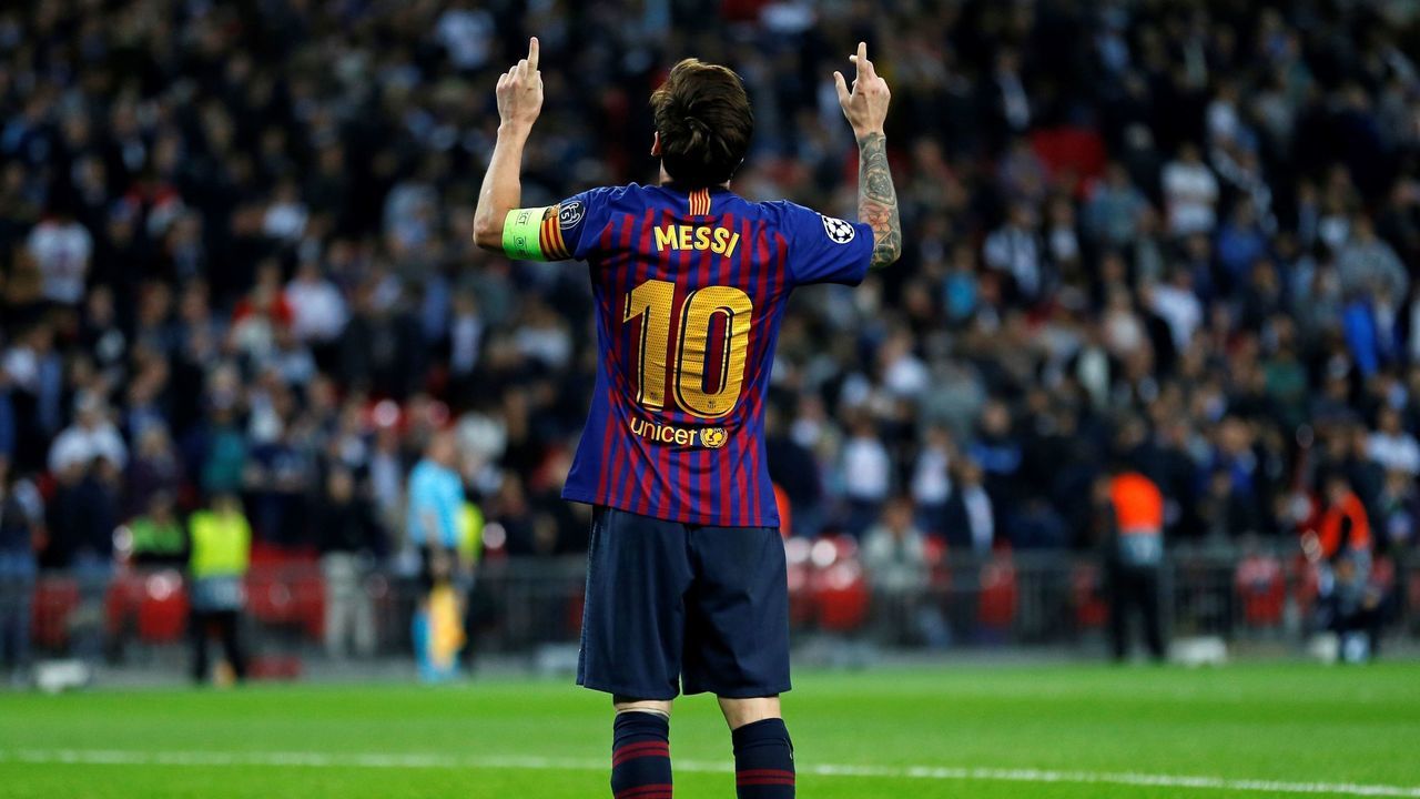 Barcelona's Argentinian striker Lionel Messi celebrates scoring his team's fourth goal, his second, during the Champions League group B football match match between Tottenham Hotspur and Barcelona at Wembley Stadium in London, on October 3, 2018.
