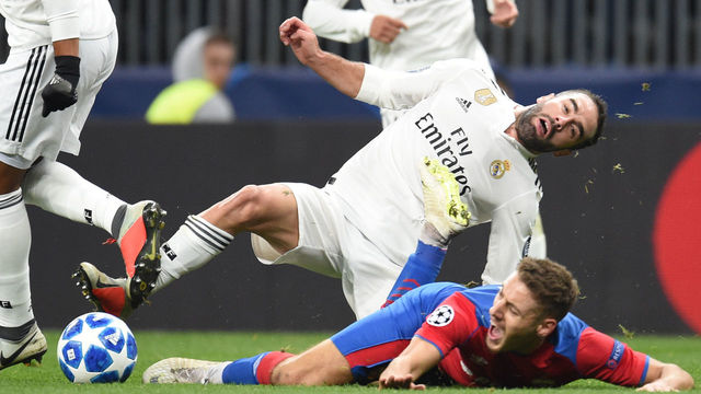 MOSCOW, RUSSIA - OCTOBER 02: Nikola Vlasic (R) of PFC CSKA Moscow is challenged by Dani Carvajal (C) and Casemiro of Real Madrid during the Group G match of the UEFA Champions League between CSKA Moscow and Real Madrid at the Luzhniki Stadium on October 02, 2018 in Moscow, Russia.