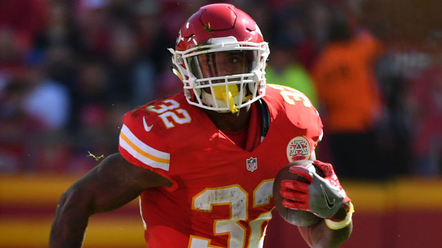 KANSAS CITY, MO - OCTOBER 23: running back Spencer Ware #32 of the Kansas City Chiefs rushes through a hole against the New Orleans Saints at Arrowhead Stadium during the first quarter of the game on October 23, 2016 in Kansas City, Missouri.