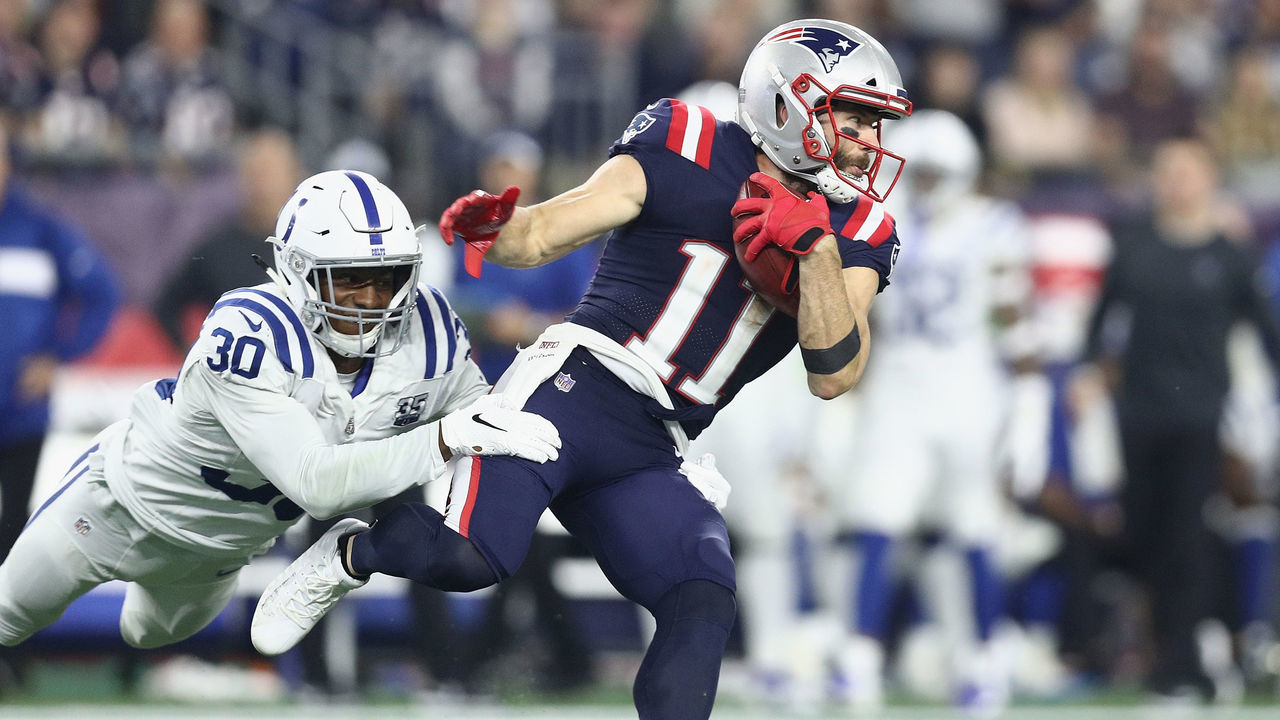 FOXBOROUGH, MA - OCTOBER 04: George Odum #30 of the Indianapolis Colts attempts to tackle Julian Edelman #11 of the New England Patriots during the first half at Gillette Stadium on October 4, 2018 in Foxborough, Massachusetts.