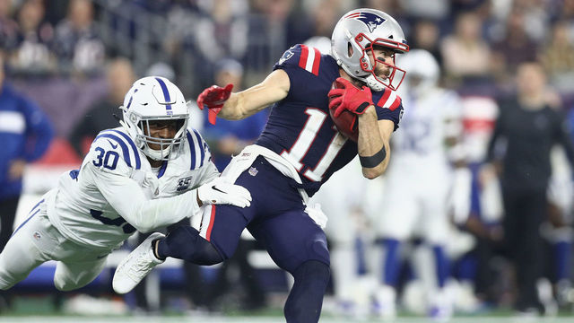 FOXBOROUGH, MA - OCTOBER 04: George Odum #30 of the Indianapolis Colts attempts to tackle Julian Edelman #11 of the New England Patriots during the first half at Gillette Stadium on October 4, 2018 in Foxborough, Massachusetts.