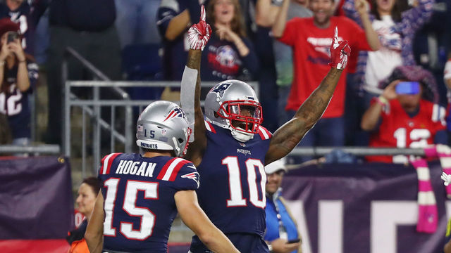 FOXBOROUGH, MA - OCTOBER 04: Josh Gordon #10 of the New England Patriots celebrates with Chris Hogan #15 after catching a touchdown pass from Tom Brady #12 (not pictured) during the fourth quarter against the Indianapolis Colts at Gillette Stadium on October 4, 2018 in Foxborough, Massachusetts. The touchdown completion to Gordon is Tom Brady's 500th career touchdown pass.