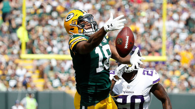 GREEN BAY, WI - SEPTEMBER 16: Mackensie Alexander #20 of the Minnesota Vikings breaks up a pass intended for Randall Cobb #18 of the Green Bay Packers during the second quarter of a game at Lambeau Field on September 16, 2018 in Green Bay, Wisconsin.