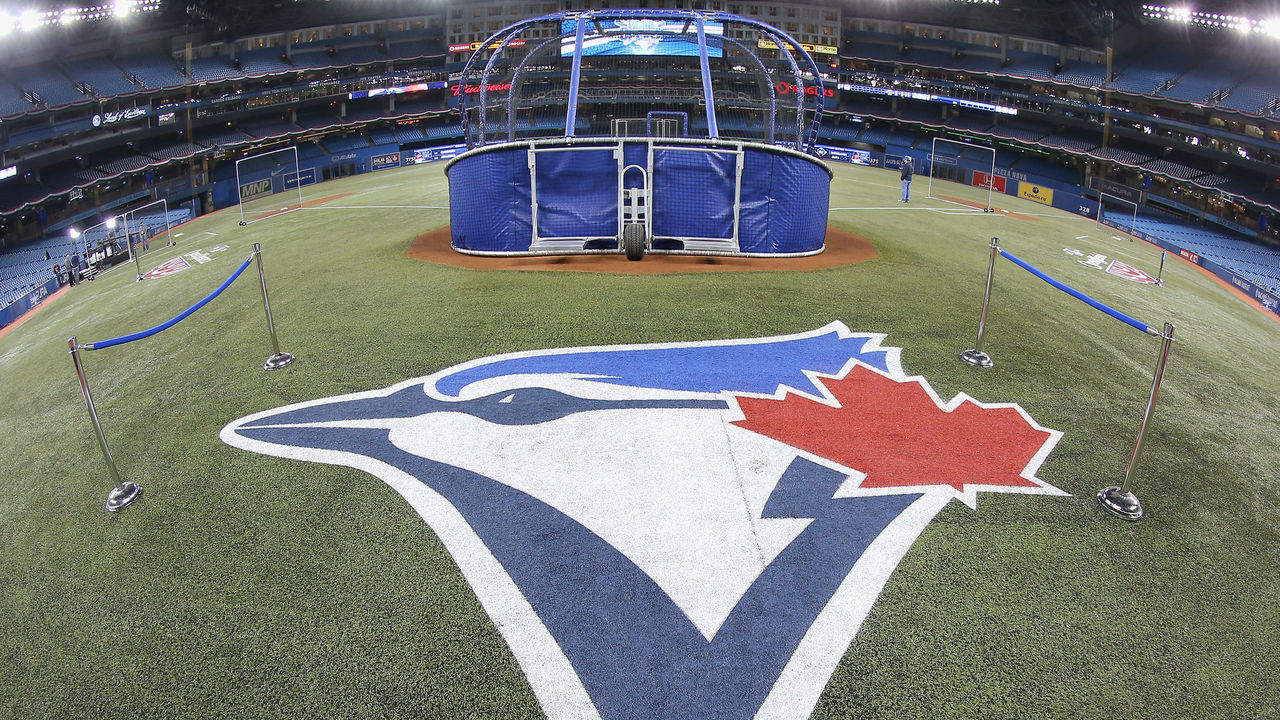 TORONTO, CANADA - APRIL 4: The Toronto Blue Jays logo painted on the field during batting practice before the Toronto Blue Jays home opener prior to the start of their MLB game against the New York Yankees on April 4, 2014 at Rogers Centre in Toronto, Ontario, Canada.