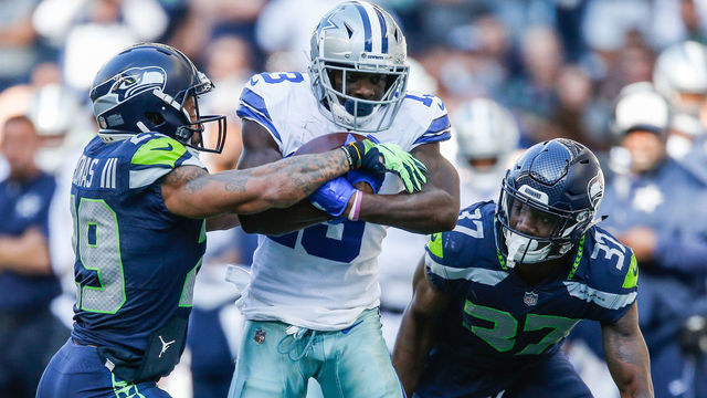 SEATTLE, WA - SEPTEMBER 23: Wide Receiver Michael Gallup #13 of the Dallas Cowboys catches a pass as Safety Earl Thomas #29 of the Seattle Seahawks defends during the second half at CenturyLink Field on September 23, 2018 in Seattle, Washington.