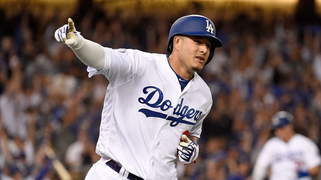 LOS ANGELES, CA - OCTOBER 05: Manny Machado #8 of the Los Angeles Dodgers rounds the bases after his two run home run in the first inning against the Atlanta Braves during Game Two of the National League Division Series at Dodger Stadium on October 5, 2018 in Los Angeles, California.