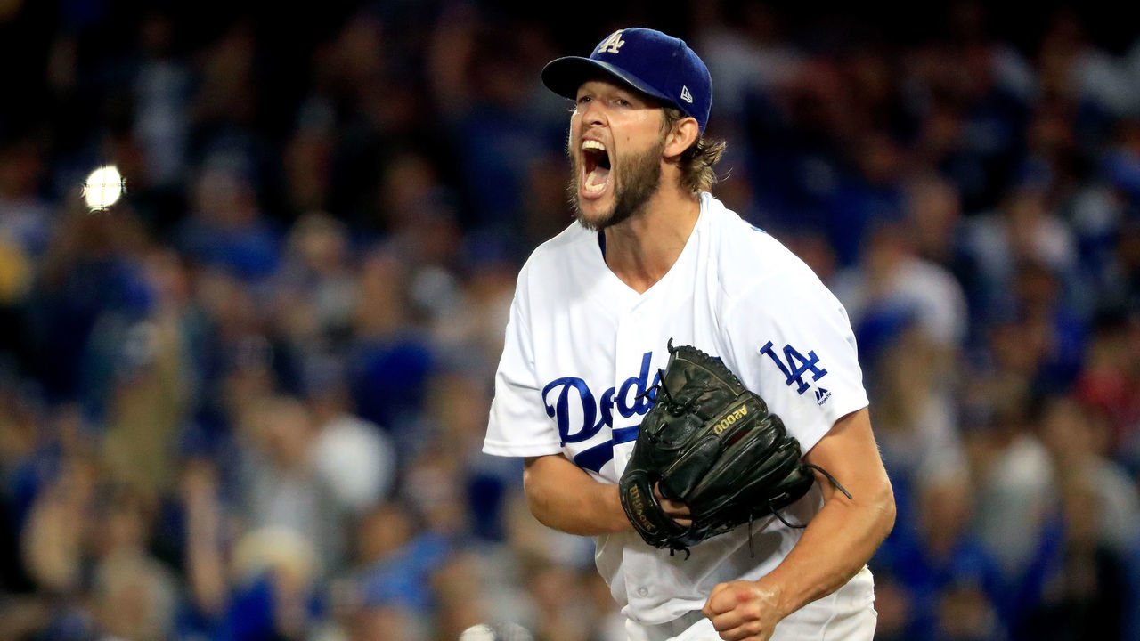 LOS ANGELES, CA - OCTOBER 05: Clayton Kershaw #22 of the Los Angeles Dodgers celebrates after retiring the side in the eighth inning against the Atlanta Braves during Game Two of the National League Division Series at Dodger Stadium on October 5, 2018 in Los Angeles, California.