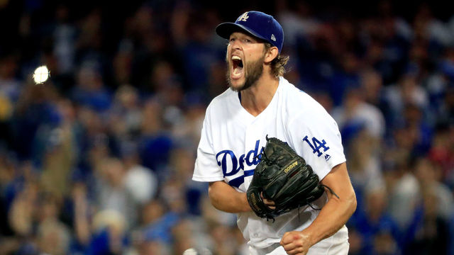 LOS ANGELES, CA - OCTOBER 05: Clayton Kershaw #22 of the Los Angeles Dodgers celebrates after retiring the side in the eighth inning against the Atlanta Braves during Game Two of the National League Division Series at Dodger Stadium on October 5, 2018 in Los Angeles, California.