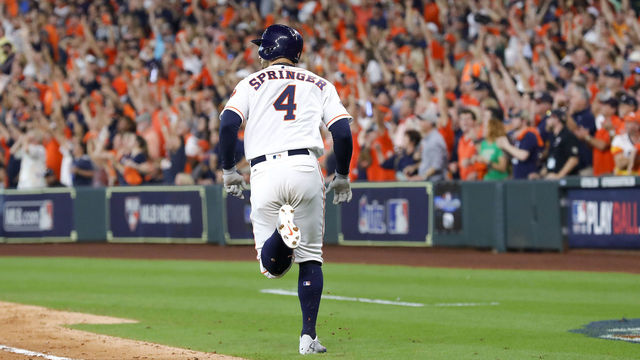 HOUSTON, TX - OCTOBER 05: George Springer #4 of the Houston Astros rounds the bases after hitting a solo home run in the fifth inning against the Cleveland Indians during Game One of the American League Division Series at Minute Maid Park on October 5, 2018 in Houston, Texas.