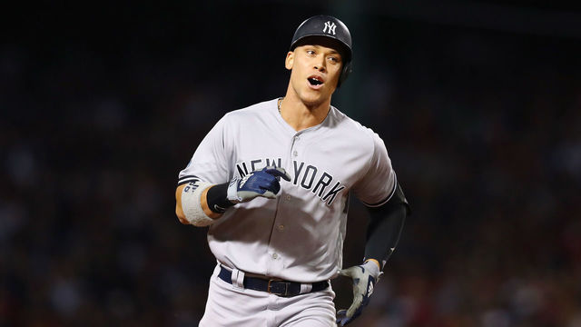 BOSTON, MA - OCTOBER 06: Aaron Judge #99 of the New York Yankees jogs toward home plate on his solo home run during the first inning of Game Two of the American League Division Series against the Boston Red Sox at Fenway Park on October 6, 2018 in Boston, Massachusetts.