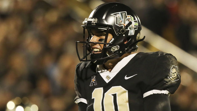 ORLANDO, FL - NOVEMBER 24: McKenzie Milton #10 of the UCF Knights celebrates after throwing a touchdown pass in the second half against the South Florida Bulls at Spectrum Stadium on November 24, 2017 in Orlando, Florida.UCF Knights defeated South Florida Bulls 49-42.