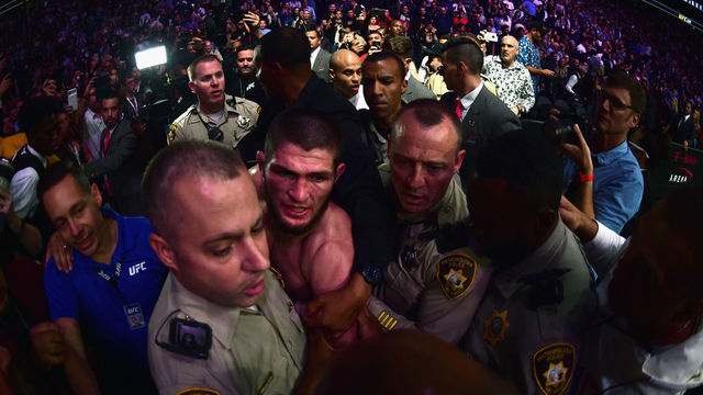 LAS VEGAS, NV - OCTOBER 06: Khabib Nurmagomedov of Russia is escorted out of the arena after defeating Conor McGregor of Ireland in their UFC lightweight championship bout during the UFC 229 event inside T-Mobile Arena on October 6, 2018 in Las Vegas, Nevada.