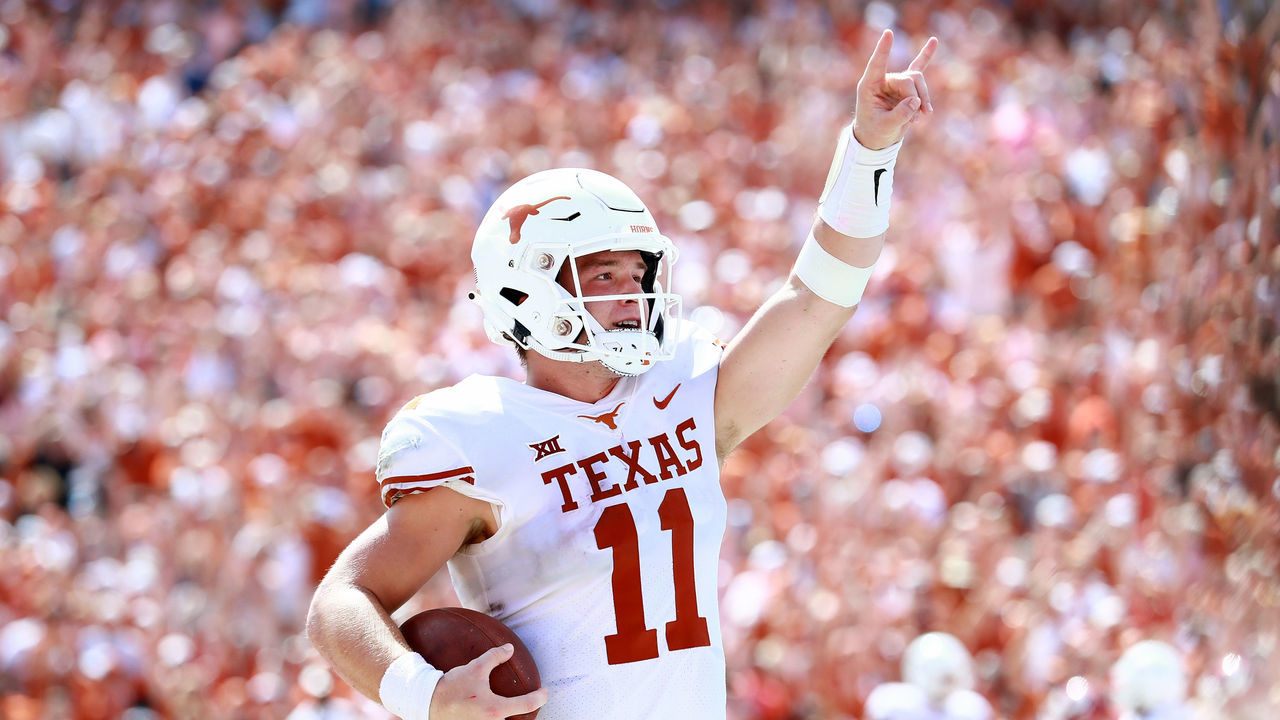 DALLAS, TX - OCTOBER 06: Sam Ehlinger #11 of the Texas Longhorns celebrates after scoring a touchdown against the Oklahoma Sooners in the third quarter of the 2018 AT&T Red River Showdown at Cotton Bowl on October 6, 2018 in Dallas, Texas.