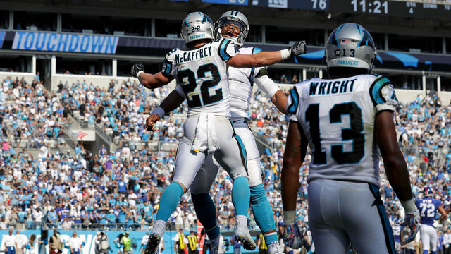 CHARLOTTE, NC - OCTOBER 07: Christian McCaffrey #22 and teammate Cam Newton #1 of the Carolina Panthers celebrate a touchdown against the New York Giants in the fourth quarter during their game at Bank of America Stadium on October 7, 2018 in Charlotte, North Carolina.
