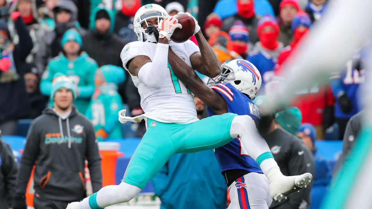 ORCHARD PARK, NY - DECEMBER 17: DeVante Parker #11 of the Miami Dolphins attempts to catch the ball as Tre'Davious White #27 of the Buffalo Bills attempts to break it up during the third quarter on December 17, 2017 at New Era Field in Orchard Park, New York.