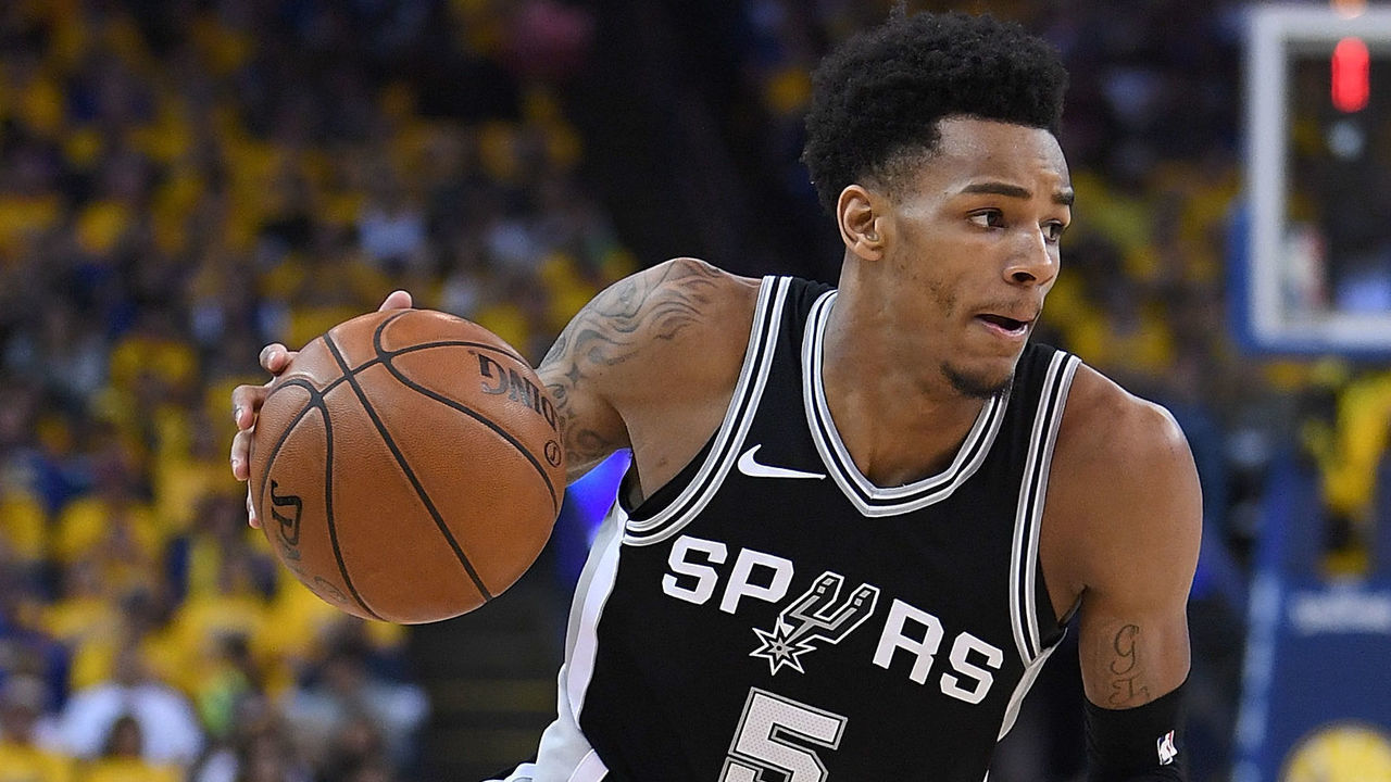 OAKLAND, CA - APRIL 14: Dejounte Murray #5 of the San Antonio Spurs drives towards the basket with the ball against the Golden State Warriors in the second quarter during Game One of the first round of the 2018 NBA Playoff at ORACLE Arena on April 14, 2018 in Oakland, California.