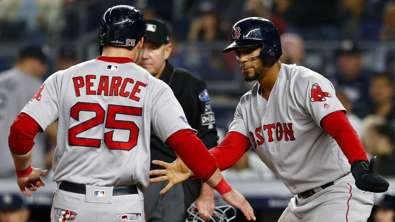 NEW YORK, NEW YORK - OCTOBER 08: Steve Pearce #25 and Xander Bogaerts #2 of the Boston Red Sox celebrate after scoring a run off of a triple hit by Brock Holt #12 against the New York Yankees during the fourth inning in Game Three of the American League Division Series at Yankee Stadium on October 08, 2018 in the Bronx borough of New York City.