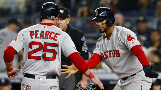 NEW YORK, NEW YORK - OCTOBER 08: Steve Pearce #25 and Xander Bogaerts #2 of the Boston Red Sox celebrate after scoring a run off of a triple hit by Brock Holt #12 against the New York Yankees during the fourth inning in Game Three of the American League Division Series at Yankee Stadium on October 08, 2018 in the Bronx borough of New York City.