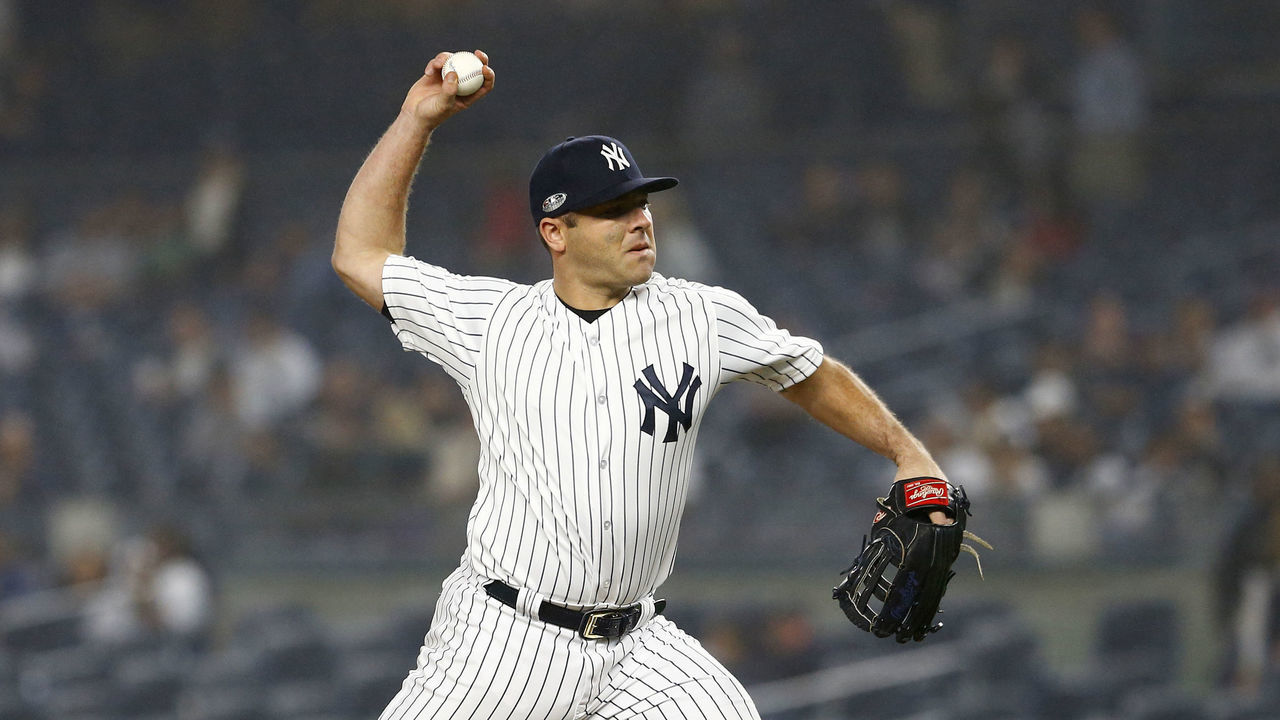 NEW YORK, NEW YORK - OCTOBER 08: Austin Romine #28 of the New York Yankees throws a pitch against the Boston Red Sox during the ninth inning in Game Three of the American League Division Series at Yankee Stadium on October 08, 2018 in the Bronx borough of New York City.