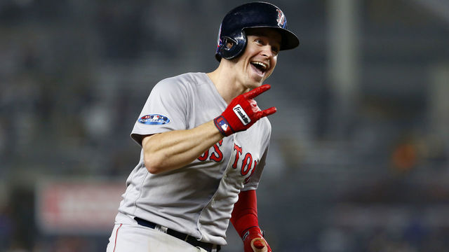 NEW YORK, NEW YORK - OCTOBER 08: Brock Holt #12 of the Boston Red Sox celebrates after hitting a two run home run against Austin Romine #28 of the New York Yankees during the ninth inning in Game Three of the American League Division Series at Yankee Stadium on October 08, 2018 in the Bronx borough of New York City.