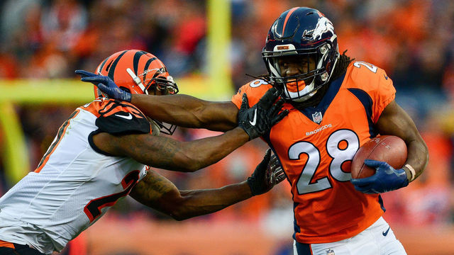 DENVER, CO - NOVEMBER 19: Running back Jamaal Charles #28 of the Denver Broncos gives a stiff arm to cornerback Dre Kirkpatrick #27 of the Cincinnati Bengals in the third quarter of a game at Sports Authority Field at Mile High on November 19, 2017 in Denver, Colorado.
