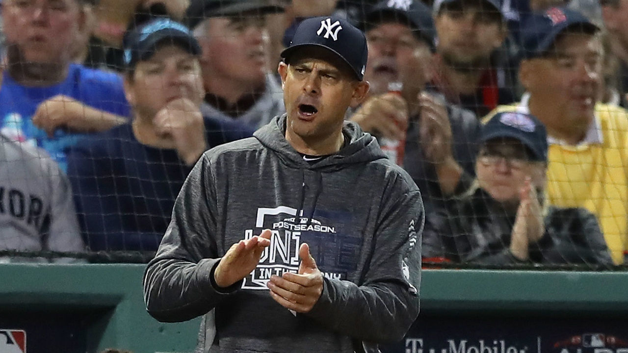 BOSTON, MA - OCTOBER 06: Manager Aaron Boone #17 of the New York Yankees reacts after Didi Gregorius #18 struck out looking as a Boston Red Sox fan looks on during the sixth inning of Game Two of the American League Division Series against the Boston Red Sox at Fenway Park on October 6, 2018 in Boston, Massachusetts.s.