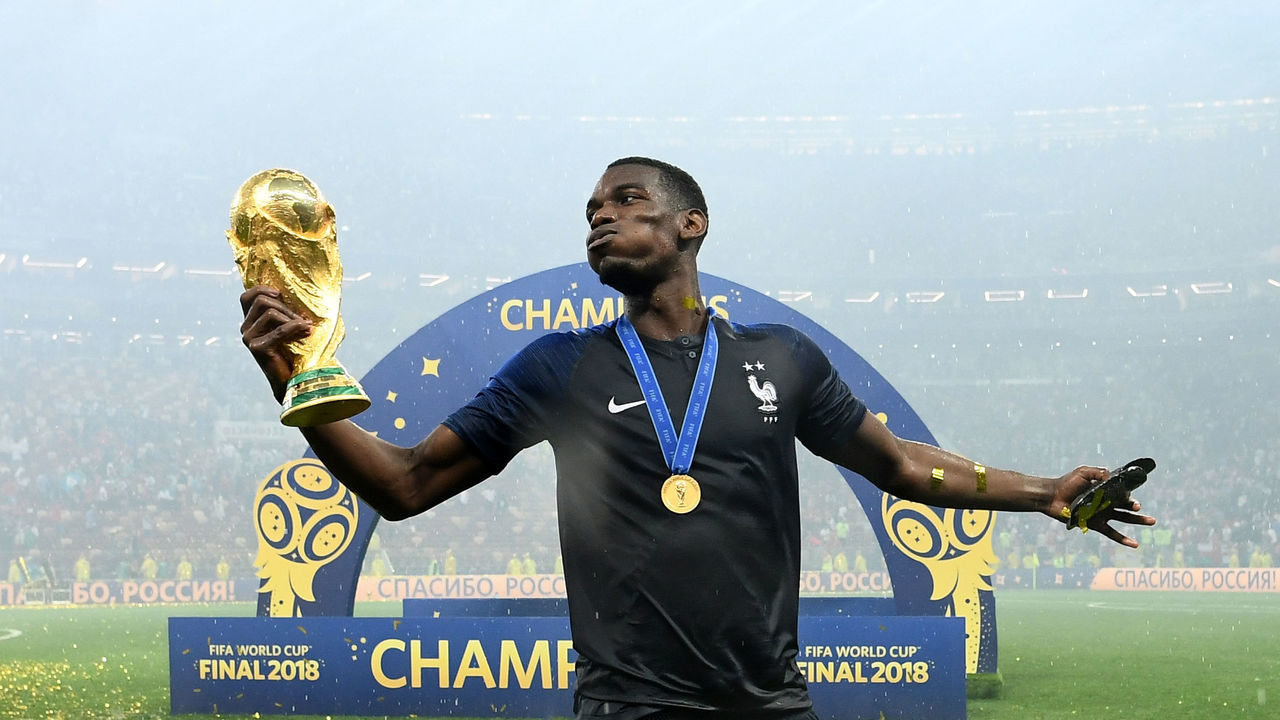 France's midfielder Paul Pogba celebrates with the World Cup trophy after the Russia 2018 World Cup final football match between France and Croatia at the Luzhniki Stadium in Moscow on July 15, 2018.