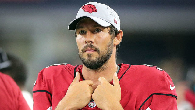 ARLINGTON, TX - AUGUST 26: Sam Bradford #9 of the Arizona Cardinals stands on the sidelines in the fourth quarter of a preseason football game against the Dallas Cowboys at AT&T Stadium on August 26, 2018 in Arlington, Texas.
