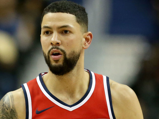 WASHINGTON, DC - OCTOBER 05: Austin Rivers #1 of the Washington Wizards dribbles the ball against the Miami Heat during the second half of a preseason NBA game at Capital One Arena on October 5, 2018 in Washington, DC.