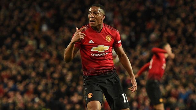 Manchester United's French striker Anthony Martial (L) celebrates after scoring the team's second goal during the English Premier League football match between Manchester United and Newcastle at Old Trafford in Manchester, north west England, on October 6, 2018.
